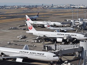 This picture taken on January 29, 2015 shows Japan Airlines planes parked at Tokyo's Haneda airport. (Getty Images)