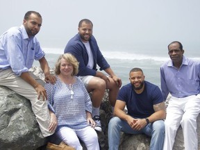 This June 2016 photo provided by Jim Jones Jr. shows, from left, Ross Jones, 21, Erin Fowler-Jones, Robert Jones, 27, and Ryan Jones, 25, and Jim Jones Jr., in Pacifica, Calif. Dozens of Peoples Temple members in Guyana survived the mass suicides and murders of more than 900 because they had slipped out of Jonestown or happened to be away Nov. 18, 1978.