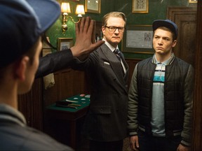 In this image released by 20th Century Fox, Colin Firth, left, and Taron Egerton appear in a scene from "Kingsmen: The Secret Service." (AP Photo/20th Century Fox, Jaap Buitendijk)