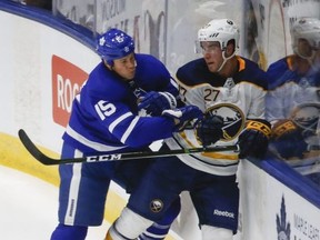 Toronto Maple Leafs Matt Martin LW (15) takes Buffalo Sabres Taylor Fedun F (45) during the first period at the Ricoh Coliseum n Toronto on Friday September 22, 2017.