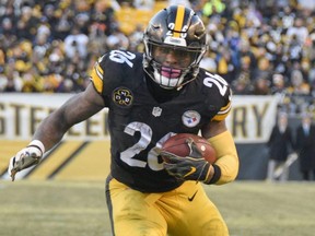 In this Jan. 14, 2018, file photo, Steelers running back Le'Veon Bell heads for the end zone after taking a pass from quarterback Ben Roethlisberger during NFL playoff action against the Jaguars, in Pittsburgh.