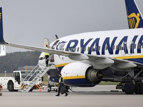 In this Wednesday, Sept. 12, 2018 file photo, a Ryanair jetplane parks at the airport in Weeze, Germany.