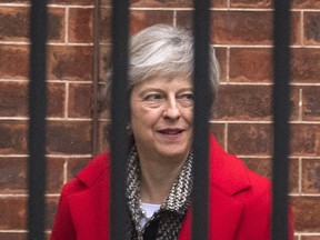 Britain's Prime Minister Theresa May leaves Downing Street in London, Friday, Nov. 16, 2018. May appealed directly to voters to back her Brexit plan Friday as she braced for a potential leadership challenge from rivals within her ruling Conservative Party.