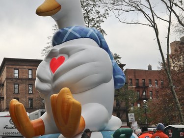 A giant balloon of the Aflac Duck is inflated the night before their appearance in the 92nd Macy's Thanksgiving Day parade, Wednesday Nov. 21, 2018, in New York.