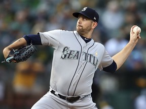 In this Saturday, Sept. 1, 2018 file photo, Seattle Mariners pitcher James Paxton works against the Oakland Athletics in Oakland, Calif.