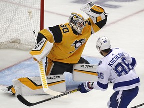 Pittsburgh Penguins goaltender Matt Murray (30) makes a glove save against the Tampa Bay Lightning in Pittsburgh, Thursday, Nov. 15, 2018. (AP Photo/Gene J. Puskar)