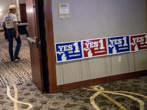 Retired Bath Township Police Det. Howard "Cowboy" Wooldrige waits for election results to come in for Proposal 18-1 during the Coalition to Regulate Marijuana Like Alcohol public watch party at The Radisson in Lansing, Mich., on Tuesday, Nov. 6, 2018.