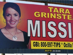 FILE - In this Oct. 4, 2006, file photo, teacher Tara Grinstead is displayed on a billboard in Ocilla, Ga. A hearing has been set to determine how a case will proceed against two men accused in the slaying a high school teacher who vanished 13 years ago. The Monday, Nov. 26, 2018, hearing will determine if most charges should be dropped against the men because too much time has passed since former beauty queen Tara Grinstead's disappearance.