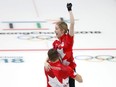 Canada's Kaitlyn Lawes and John Morris celebrate their gold medal win against Switzerland during the Mixed Doubles Curling at the 2018 Winter Olympic Games, in Gangneung, South Korea on Tuesday, Feb. 13, 2018.