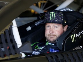In this July 20, 2018, file photo, Kurt Busch waits in his car before NASCAR Cup Series auto racing practice at New Hampshire Motor Speedway in Loudon, N.H.