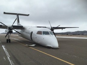 A plane is shown after it crash-landed at the airport in Stephenville, N.L., Thursday, Nov. 15, 2018. Mayor Tom Rose says the nose gear collapsed on a PAL Airlines plane as it was landing just after noon local time today.