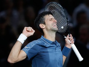 Novak Djokovic of Serbia celebrates after defeating Marin Cilic of Croatia during their quarterfinal match of the Paris Masters tennis tournament at the Bercy Arena in Paris, France, Friday, Nov. 2, 2018.