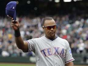 In this Sept. 30, 2018, file photo, Texas Rangers' Adrian Beltre tips his cap as he walks off the field during the fifth inning of a baseball game against the Seattle Mariners.