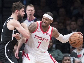 In this Friday, Nov. 2, 2018 file photo, Brooklyn Nets forward Joe Harris guards Houston Rockets forward Carmelo Anthony (7) during the second half of an NBA basketball game in New York.