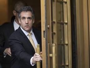 In this Aug. 21, 2018, file photo, Michael Cohen leaves Federal Court, in New York.