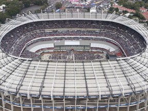 In this June 27, 2018, file photo, supporters of presidential candidate Andres Manuel Lopez Obrador, of the MORENA party, fill Azteca stadium as they wait for him to arrive for his closing campaign rally in Mexico City.