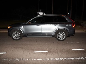 This file photo provided by the Tempe Police Department shows an Uber SUV after hitting a woman on March 18, 2018, in Tempe, Ariz.