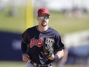 In this Feb. 26, 2018, file photo, Cleveland Indians outfielder Lonnie Chisenhall runs to the dugout during a spring training baseball game against the Milwaukee Brewers in Maryvale, Ariz.