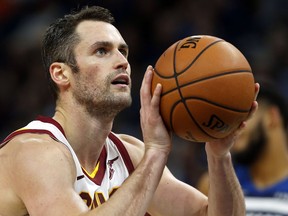 In this Oct. 19, 2018, file photo, Cleveland Cavaliers' Kevin Love shoots a free throw against the Minnesota Timberwolves in Minneapolis.