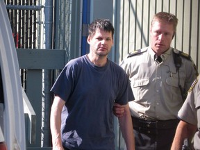 Accused child abductor Randall Hopley is led out of the Cranbrook, B.C., courthouse on Wednesday Sept. 14, 2011.