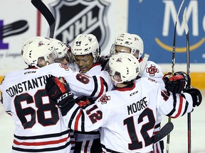 Akil Thomas of the Niagara IceDogs celebrates a goal with teammates against the Barrie Colts at Meridian Centre on October 11, 2018 in St. Catharines. (Vaughn Ridley/Getty Images)