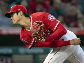In this June 6, 2018 file photo Los Angeles Angels starting pitcher Shohei Ohtani watches a pitch against the Kansas City Royals in Anaheim, Calif. (AP Photo/Kyusung Gong, file)