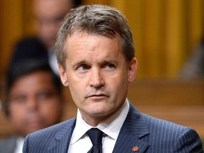 Minister of Veterans Affairs Seamus O'Regan rises during Question Period in the House of Commons on Parliament Hill in Ottawa on Monday, Sept. 24, 2018.
