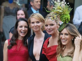 (From L to R) US actresses Kristin Davis, Cynthia Nixon, Kim Catrall, and Sarah Jessica Parker pose for the photographers after arriving in London's Leicester Square on May 12, 2008, to attend the World Premiere of their film, Sex and the City. AFP PHOTO/Max Nash