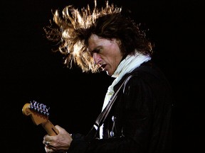 In this Saturday, June 2, 2007, file photo, American rock band Aerosmith's guitarist Joe Perry performs during a concert in Bangalore, India.