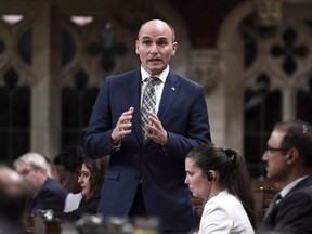 Social Development Minister Jean-Yves Duclos is expected to outline the new law, a plan to lift more than two million people out of poverty, to a group of anti-poverty activists. Minister Duclos rises during Question Period in the House of Commons on Parliament Hill in Ottawa on Friday, May 25, 2018.