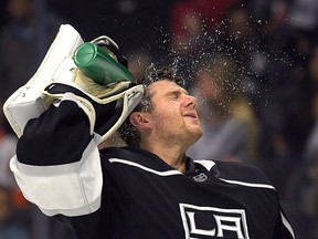 Los Angeles Kings goaltender Jonathan Quick sprays water in his face prior to the first period of an NHL game against the Anaheim Ducks, Saturday, Sept. 29, 2018, in Los Angeles.