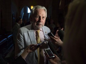 Sen. Peter Harder speaks on Parliament Hill in Ottawa on Tuesday, June 19, 2018.