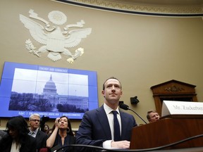 In this April 11, 2018 file photo, Facebook CEO Mark Zuckerberg returns after a break to continue testifying at a House Energy and Commerce hearing on Capitol Hill in Washington, about the use of Facebook data to target American voters in the 2016 election and data privacy.