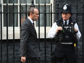 Britain's Secretary of State for Exiting the European Union Dominic Raab, leaves after a cabinet meeting at 10 Downing Street in London, Tuesday, Nov. 13, 2018. Negotiators from Britain and the European Union have struck a proposed divorce deal that will be presented to politicians on both sides for approval, officials in London and Brussels said Tuesday.