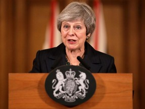Britain's Prime Minister Theresa May gives a press conference inside 10 Downing Street in London on Thursday, Nov. 15, 2018.