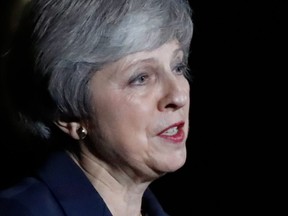 Britain's Prime Minister Theresa May gives a statement outside 10 Downing Street in London on Wednesday, Nov. 14, 2018.