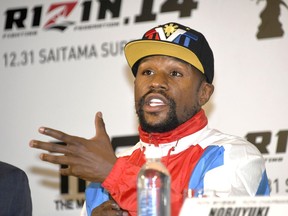 Floyd Mayweather of the U.S. speaks during a press conference in Tokyo, Monday, Nov. 5, 2018. Mayweather said he has signed to fight Japanese kickboxer Tenshin Nasukawa for a bout promoted by Japan's RIZIN Fighting Federation on Dec. 31 in Saitama, north of Tokyo.