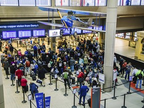 Travelers wait in security lines at the Pittsburgh International Airport on Tuesday, Nov. 20, 2018, in Moon, Pa. (Andrew Rush/Pittsburgh Post-Gazette via AP)
