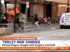 Michael Rogers, a homeless man, was hailed as a hero and dubbed “Trolleyman” on social media after ramming a knife-wielding man with a shopping cart in a deadly terror attack in Melbourne last week. (7 News Melbourne screengrab)