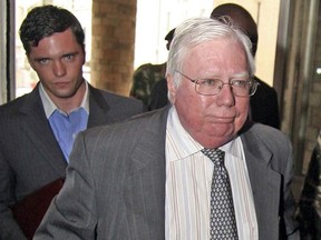 FILE - In this Oct. 7, 2008, file photo, Jerome Corsi, right, arrives at the immigration department in Nairobi, Kenya. Corsi, a conservative writer and associate of President Donald Trump confidant Roger Stone says he is in plea talks with special counsel Robert Mueller's team. Jerome Corsi told The Associated Press on Friday, Nov. 23, 2018, that he has been negotiating a potential plea but declined to comment further.