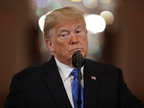 President Donald Trump listens to a question during a news conference in the East Room of the White House, Wednesday, Nov. 7, 2018, in Washington.