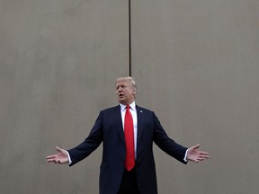 In this March 13, 2018, file photo, President Donald Trump speaks during a tour as he reviews border wall prototypes in San Diego. (AP Photo/Evan Vucci, File)