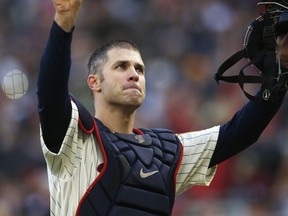 In this Sept. 30, 2018, file photo, Twins' Joe Mauer acknowledges a standing ovation as he donned catcher's gear and caught for one pitch against a White Sox batter in the ninth inning of a game  in Minneapolis.