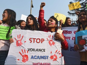In this file photo taken on March 8, 2018, women shout slogans during an International Women's Day rally in Kathmandu.  (PRAKASH MATHEMA/AFP/Getty Images)