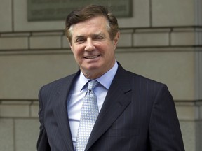 FILE - In this May 23, 2018, file photo, Paul Manafort, President Donald Trump's former campaign chairman, leaves the Federal District Court after a hearing, in Washington. Special counsel Robert Mueller is accusing Manafort of lying to federal investigators in the Russia probe in breach of his plea agreement. Prosecutors say in a new court filing that after Manafort agreed to truthfully cooperate with the investigation, he "committed federal crimes" by lying about "a variety of subject matters."