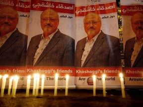 In this Oct. 25, 2018, file photo, candles, lit by activists protesting the killing of Saudi journalist Jamal Khashoggi, are placed outside Saudi Arabia's consulate, in Istanbul, during a candlelight vigil.