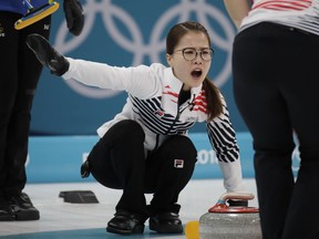 FILE - In this Feb. 25, 2018 file photo, Kim Eun-jung, of South Korea, yells during their women's curling final in the Gangneung Curling Centre at the 2018 Winter Olympics in Gangneung, South Korea. Five-member women's curling team accused former Korean Curling Federation (KCF) vice-president Kim Kyong-doo of verbal abuse and team coaches of giving unreasonable orders and subjecting their private lives to excessive control.