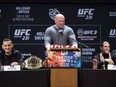 UFC president Dana White (centre) speaks as Max Holloway (left) and Brian Ortega talk to the media on Wednesday, Dec. 5, 2018.