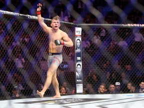 Brad Katona of Winnipeg celebrates victory against Matthew Lopez of the United States in a bantamweight bout during the UFC 231 event at Scotiabank Arena on Dec. 8, in Toronto.