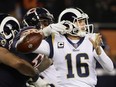 Quarterback Jared Goff #16 of the Los Angeles Rams gets the football stripped by Khalil Mack #52 of the Chicago Bears in the third quarter at Soldier Field on December 9, 2018 in Chicago, Illinois.